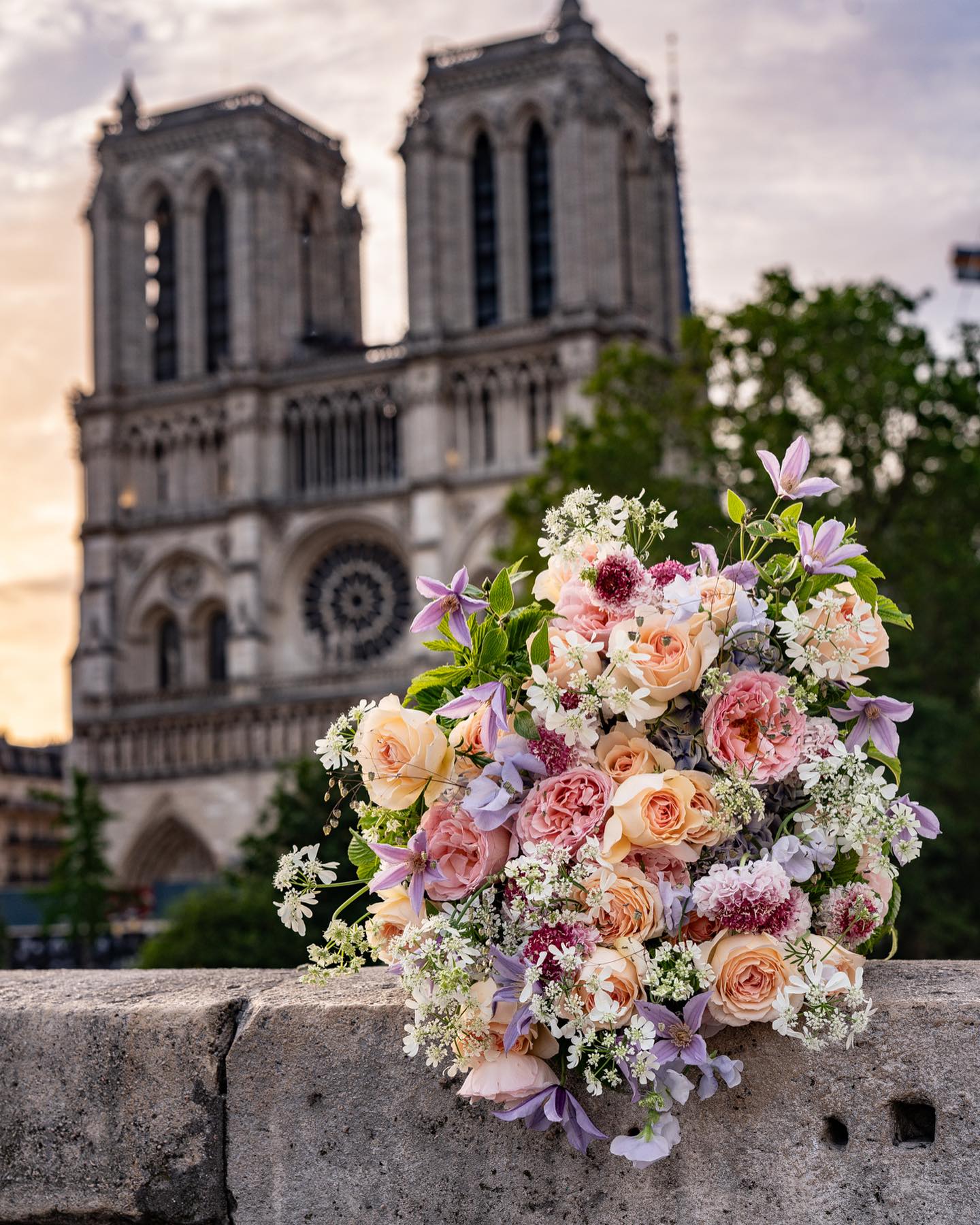 The reason why we place bouquets on the streets of Paris and take photos